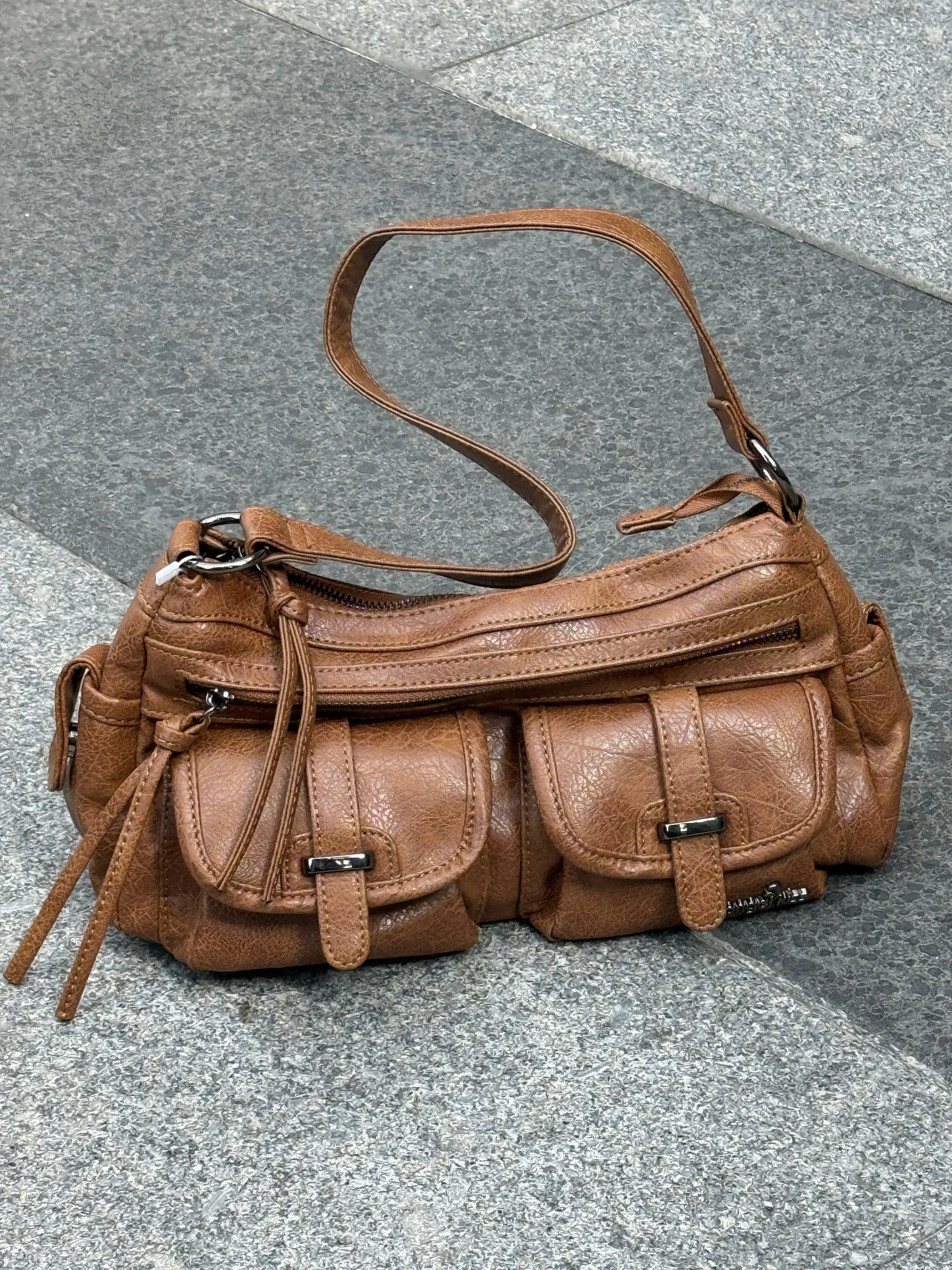 The Savior for All-Black Outfits: How to Style Bright-Colored Bags for a Standout Look