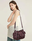 Textured Multi-Pocket Shoulder Bag with Rivet Details