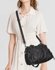 Vintage Multi-Pocket Shoulder Bag with Lace-Up Studded Details